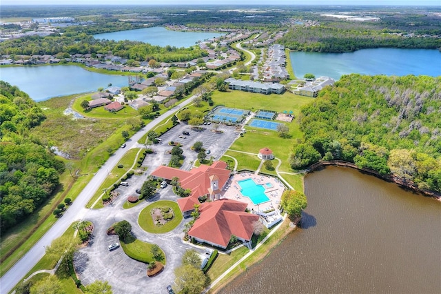 birds eye view of property with a water view