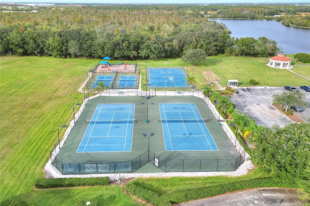 drone / aerial view with a view of trees and a water view