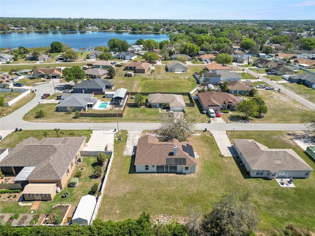 bird's eye view with a water view and a residential view