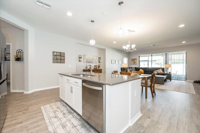 kitchen featuring stainless steel dishwasher, light wood-type flooring, visible vents, and a sink