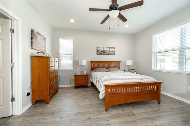 bedroom featuring recessed lighting, baseboards, light wood-type flooring, and ceiling fan