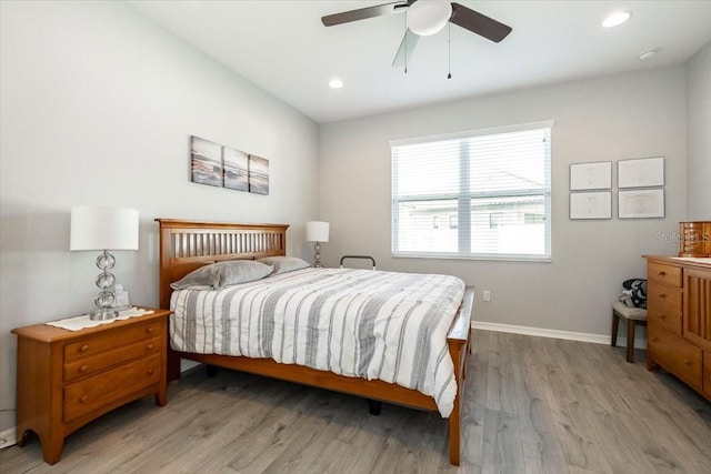 bedroom featuring recessed lighting, light wood-type flooring, baseboards, and ceiling fan