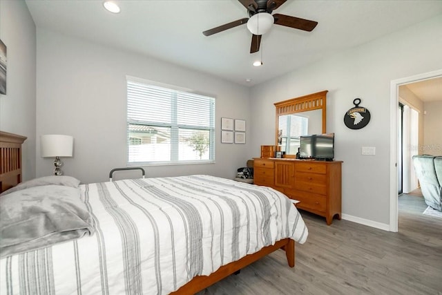 bedroom featuring recessed lighting, light wood-type flooring, baseboards, and a ceiling fan