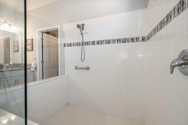 full bath with a tile shower