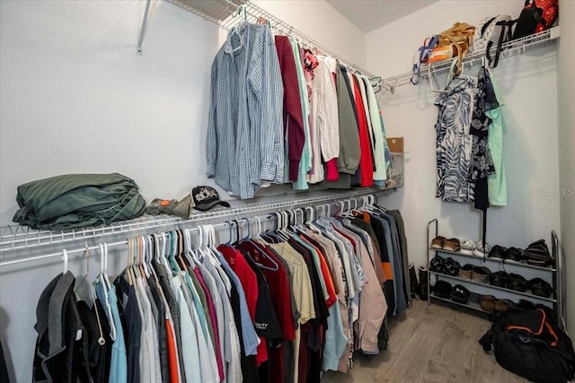 spacious closet with wood finished floors