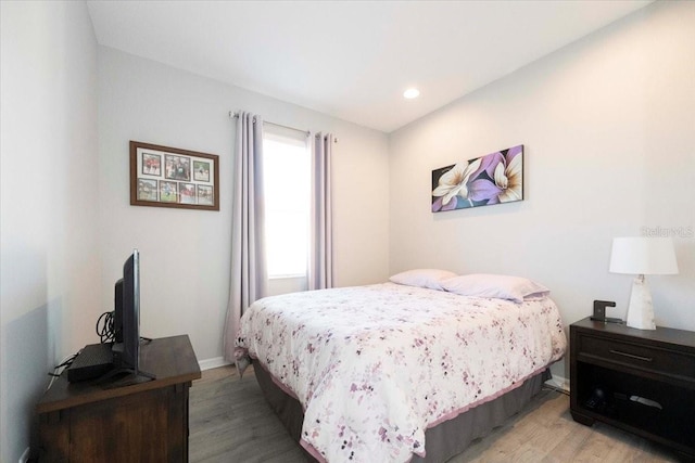 bedroom featuring recessed lighting, baseboards, and light wood-style flooring