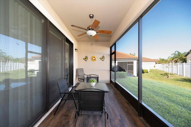 sunroom / solarium with ceiling fan