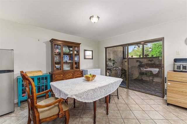 dining area with light tile patterned floors