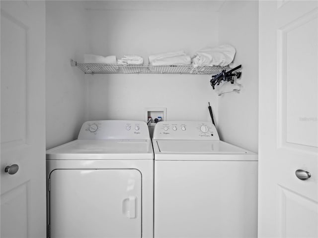 washroom featuring laundry area and washer and dryer