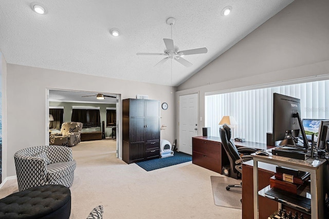 office with vaulted ceiling, a ceiling fan, carpet floors, and a textured ceiling