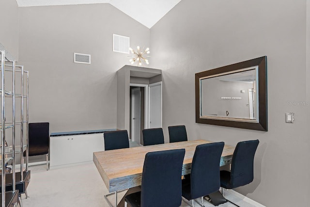 dining room featuring carpet, visible vents, and high vaulted ceiling