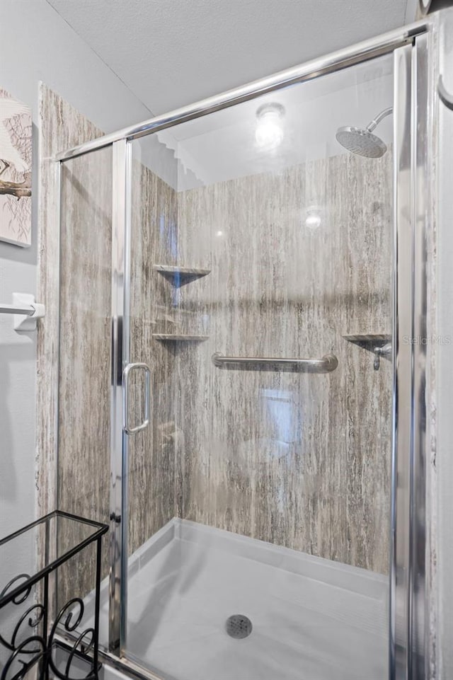 bathroom featuring a stall shower