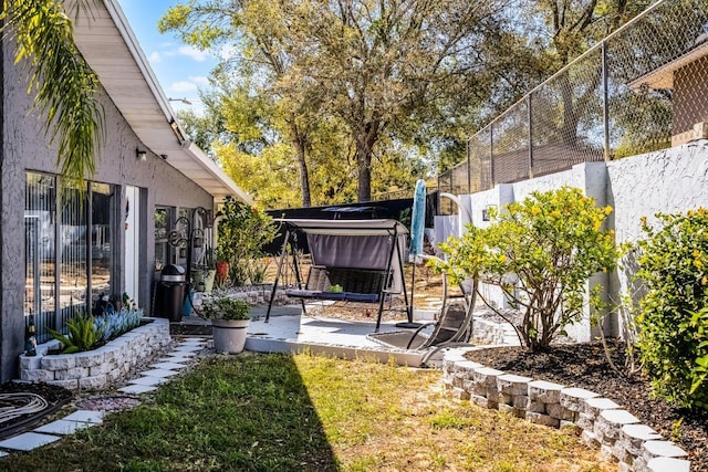 view of yard featuring a patio and fence