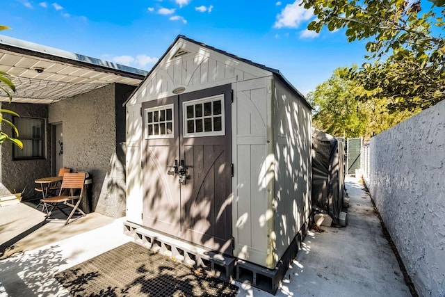 view of shed with a fenced backyard