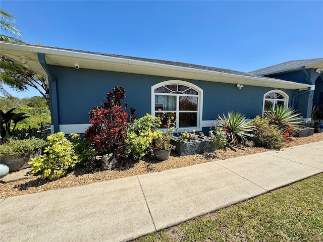 exterior space featuring stucco siding