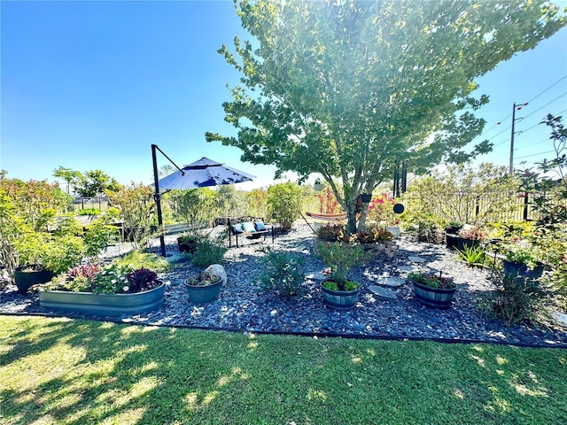 view of yard featuring a garden and fence