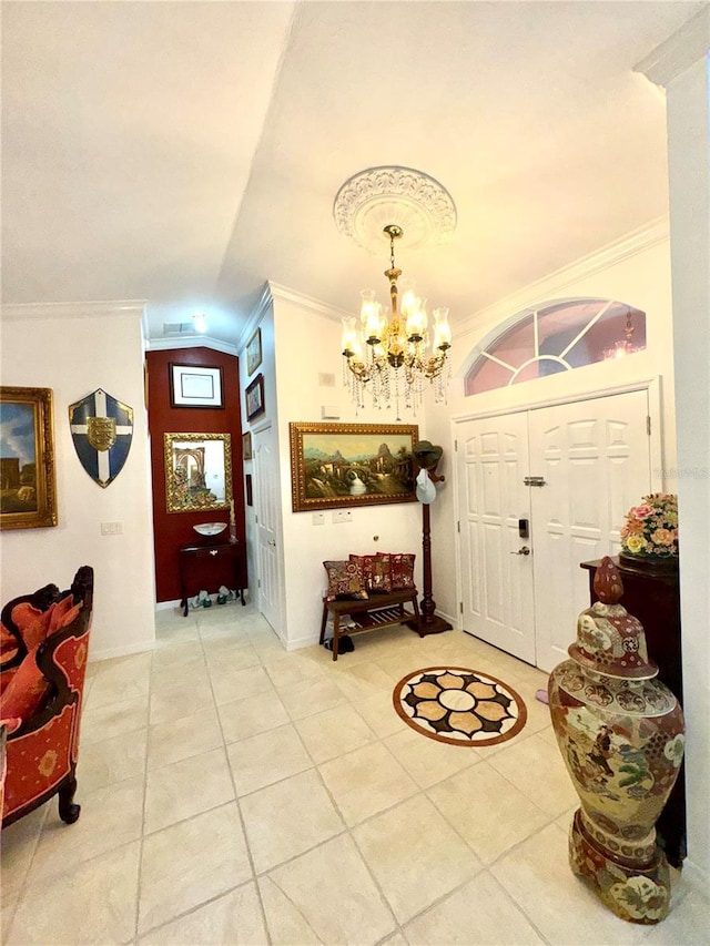 entryway with light tile patterned floors, a notable chandelier, baseboards, and ornamental molding