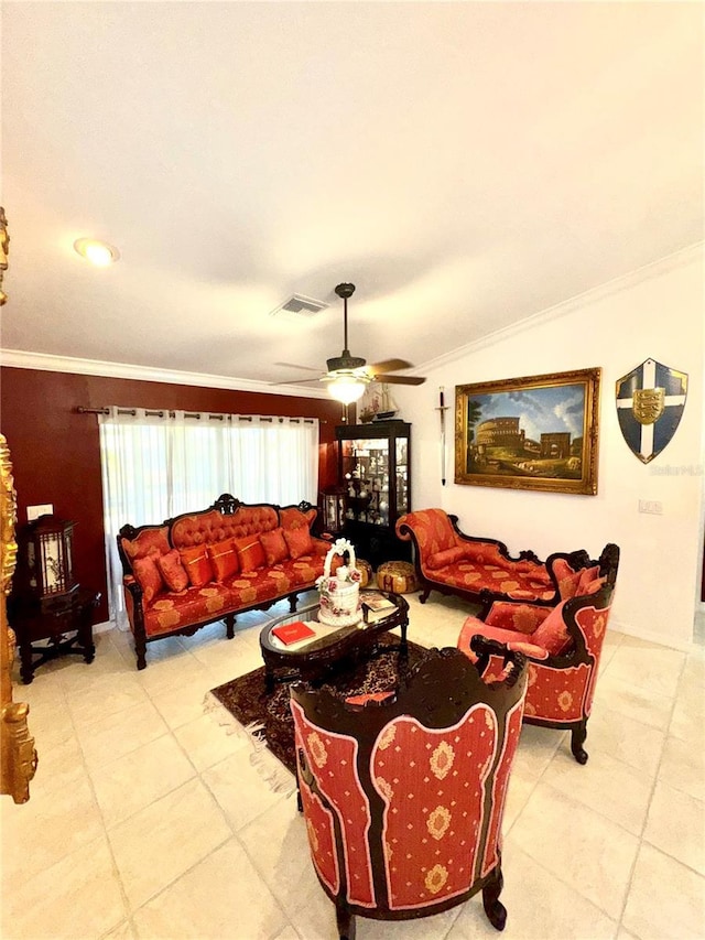 living area featuring visible vents, a ceiling fan, and ornamental molding