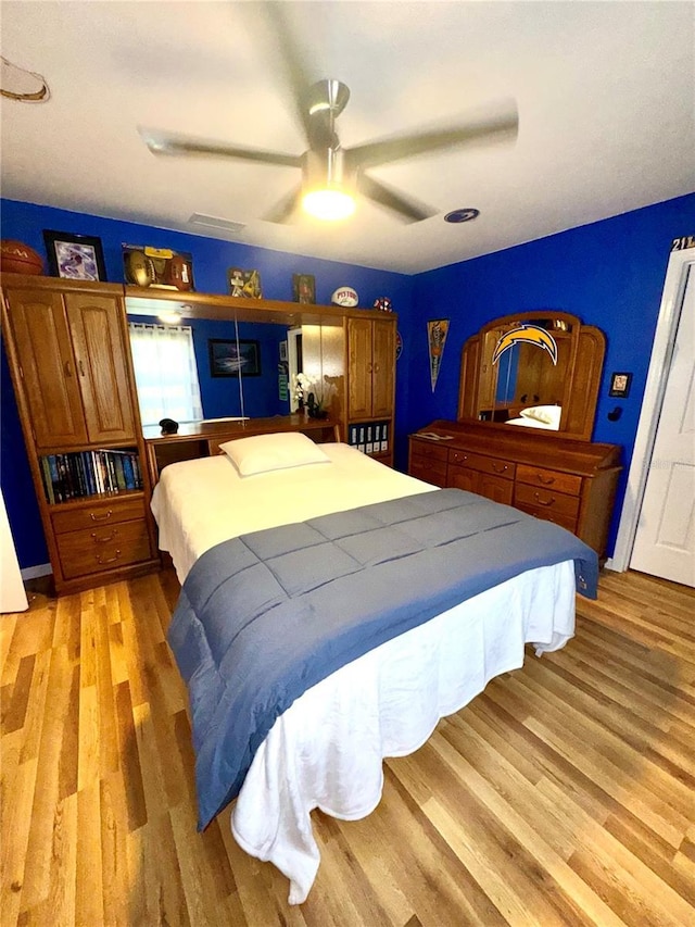 bedroom featuring light wood-style flooring