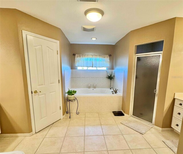 full bath with vanity, visible vents, a stall shower, a garden tub, and tile patterned floors