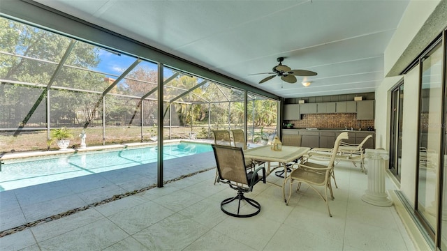 outdoor pool featuring outdoor dining space, a patio, a lanai, and ceiling fan