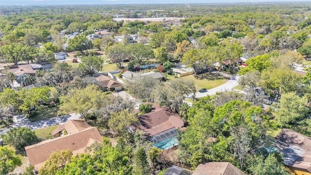 birds eye view of property featuring a residential view and a view of trees