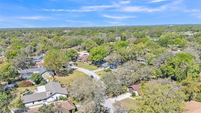 birds eye view of property with a residential view and a view of trees