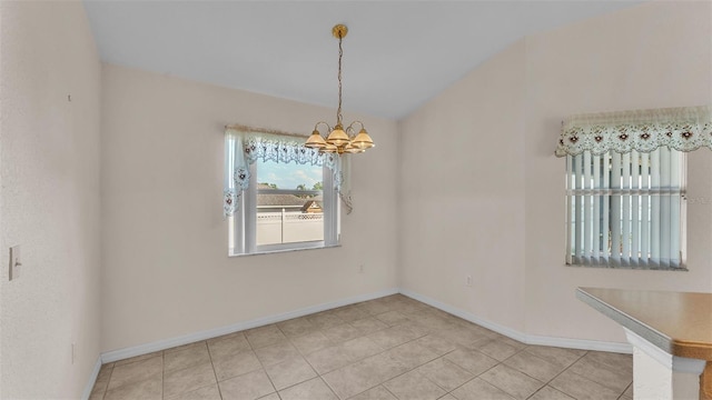 unfurnished dining area featuring vaulted ceiling, a notable chandelier, baseboards, and light tile patterned floors