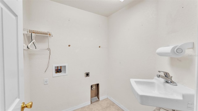 laundry room with baseboards, washer hookup, laundry area, electric dryer hookup, and a sink