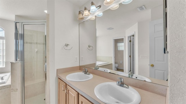 full bath featuring a shower stall, toilet, a bath, and a sink