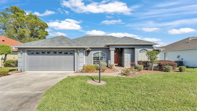 single story home featuring a front yard, driveway, central AC, stucco siding, and a garage