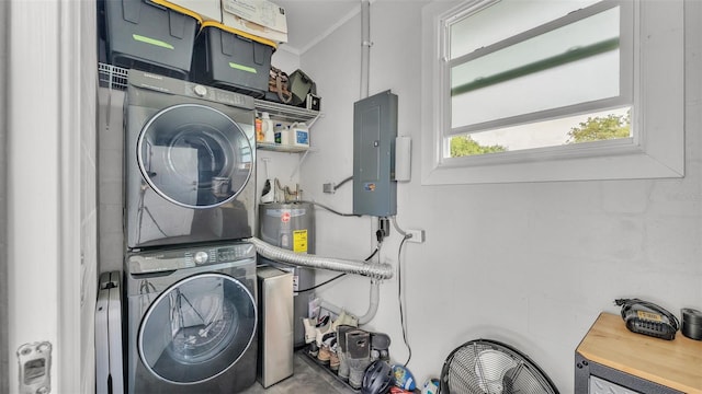 laundry area with laundry area, electric panel, water heater, ornamental molding, and stacked washer and clothes dryer