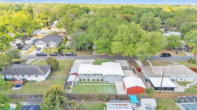 bird's eye view featuring a view of trees and a residential view