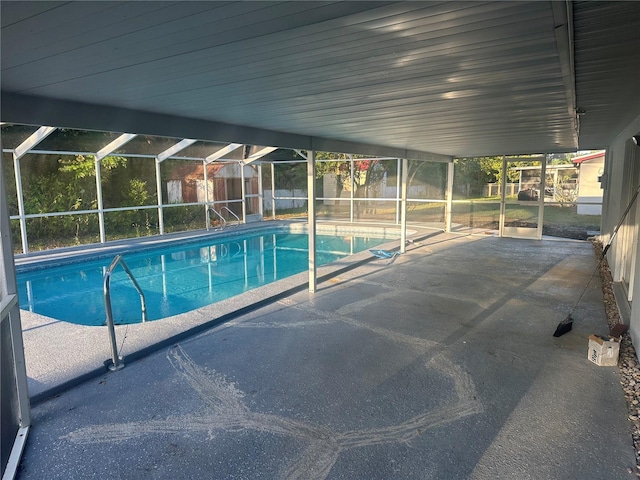 view of swimming pool with a patio area, a fenced in pool, a lanai, and fence