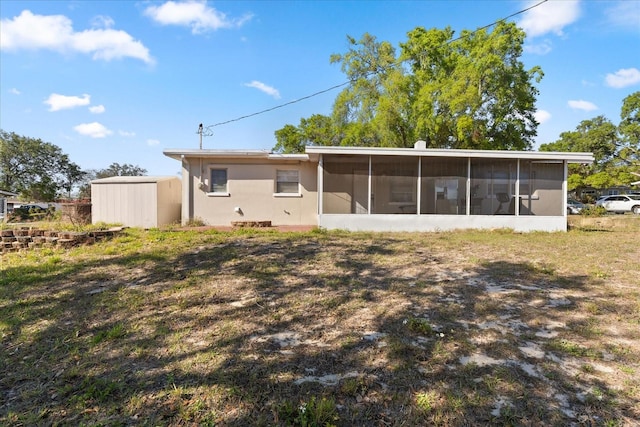 rear view of house with a sunroom