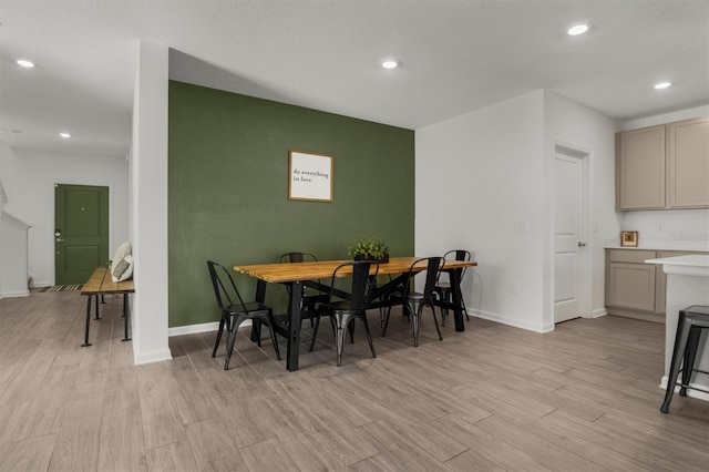 dining area featuring recessed lighting, baseboards, and light wood-style floors