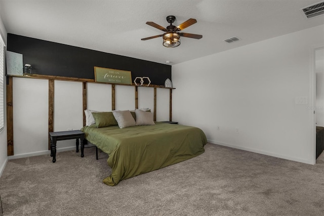 bedroom featuring visible vents, carpet floors, and baseboards