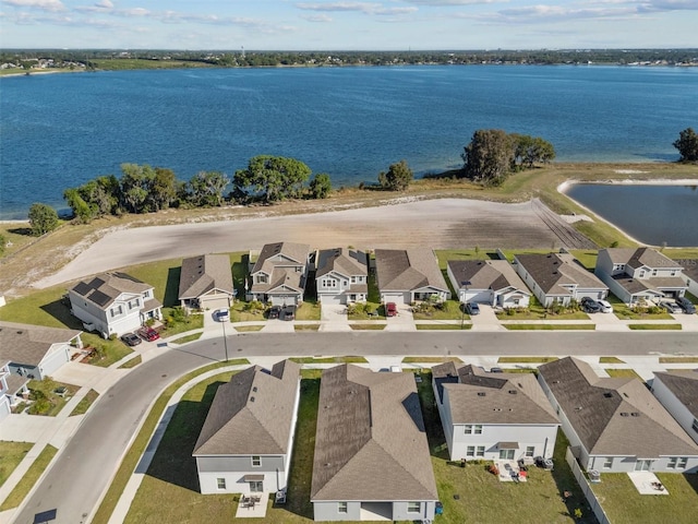 aerial view featuring a residential view and a water view