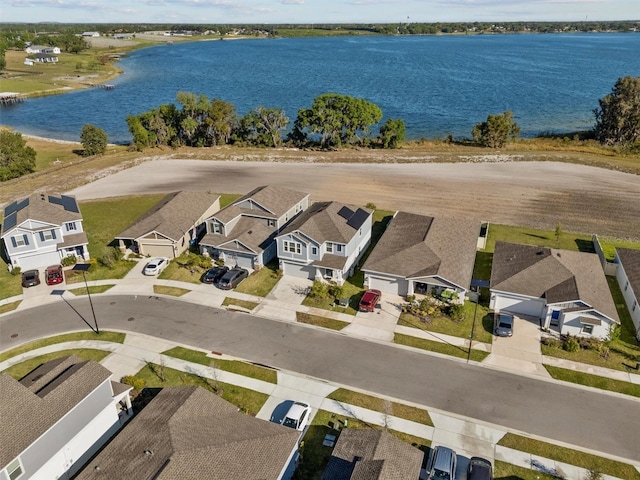 aerial view featuring a residential view and a water view