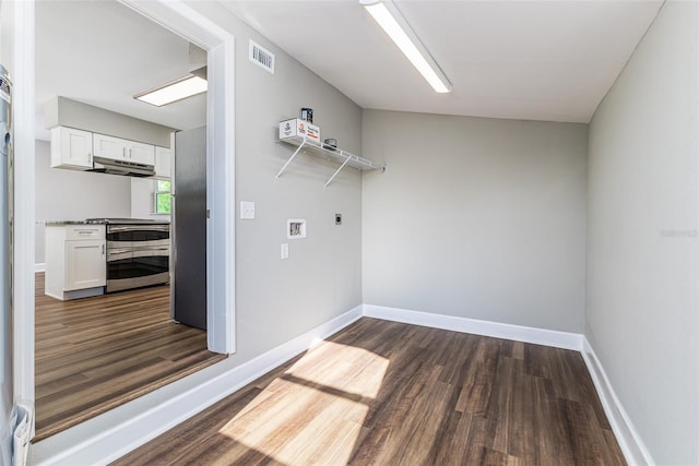 washroom featuring washer hookup, dark wood finished floors, visible vents, and baseboards