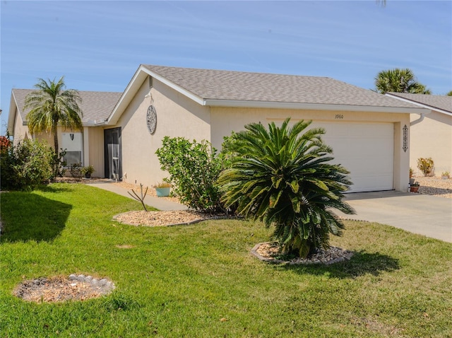 view of front of home with concrete driveway, a front lawn, a garage, and stucco siding