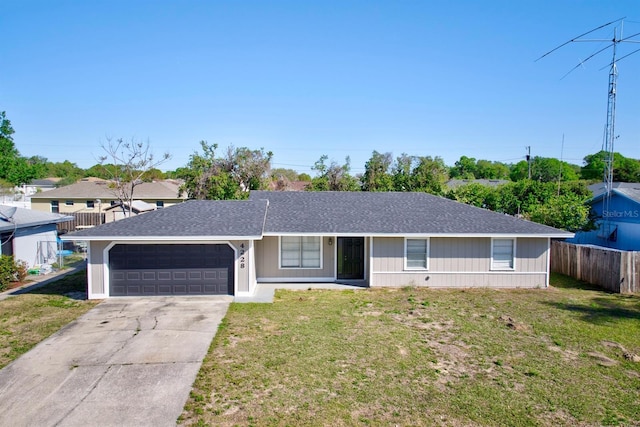 ranch-style house with a front yard, fence, an attached garage, a shingled roof, and concrete driveway