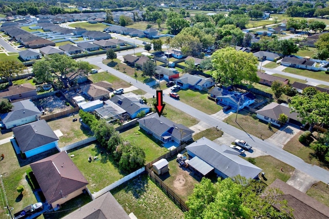 birds eye view of property with a residential view