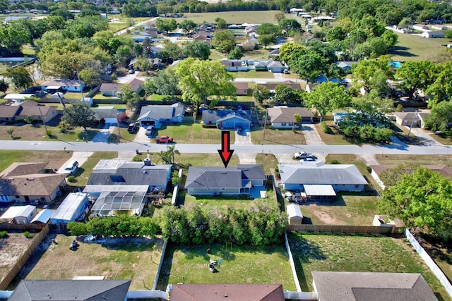 birds eye view of property with a residential view