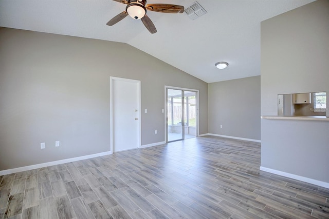 unfurnished living room with visible vents, lofted ceiling, light wood-style floors, and a ceiling fan