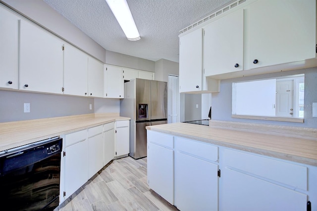 kitchen with beverage cooler, light countertops, white cabinets, stainless steel refrigerator with ice dispenser, and a textured ceiling