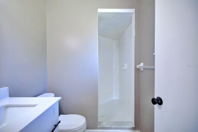 full bath featuring vanity, toilet, and a shower stall