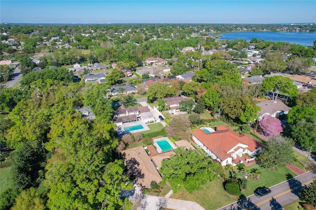 birds eye view of property with a residential view and a water view