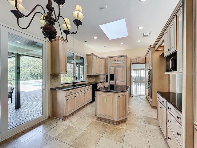 kitchen featuring visible vents, a kitchen island, a skylight, decorative backsplash, and black appliances