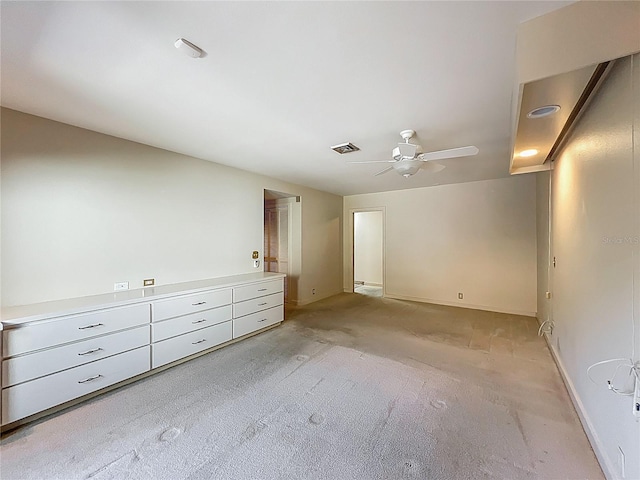 unfurnished bedroom with light colored carpet, visible vents, and ceiling fan